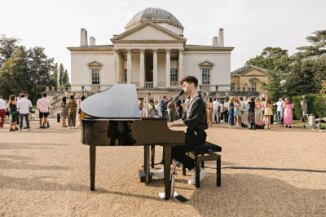 Elegant outdoor event at Chiswick House with live pianist, perfect for celebrations and networking.