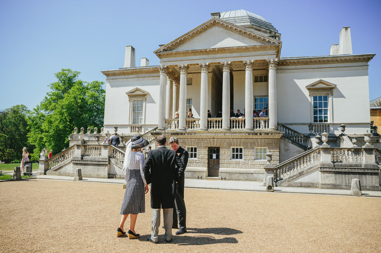 Elegant outdoor event at Chiswick House with sophisticated architecture and networking.