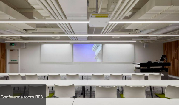 Modern conference room at UCL Venues, featuring reconfigurable tables for workshops.