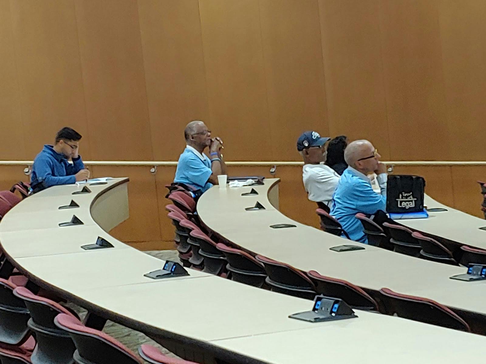 Catherine and Joseph Aresty Auditorium meeting room with attendees engaged in a workshop.