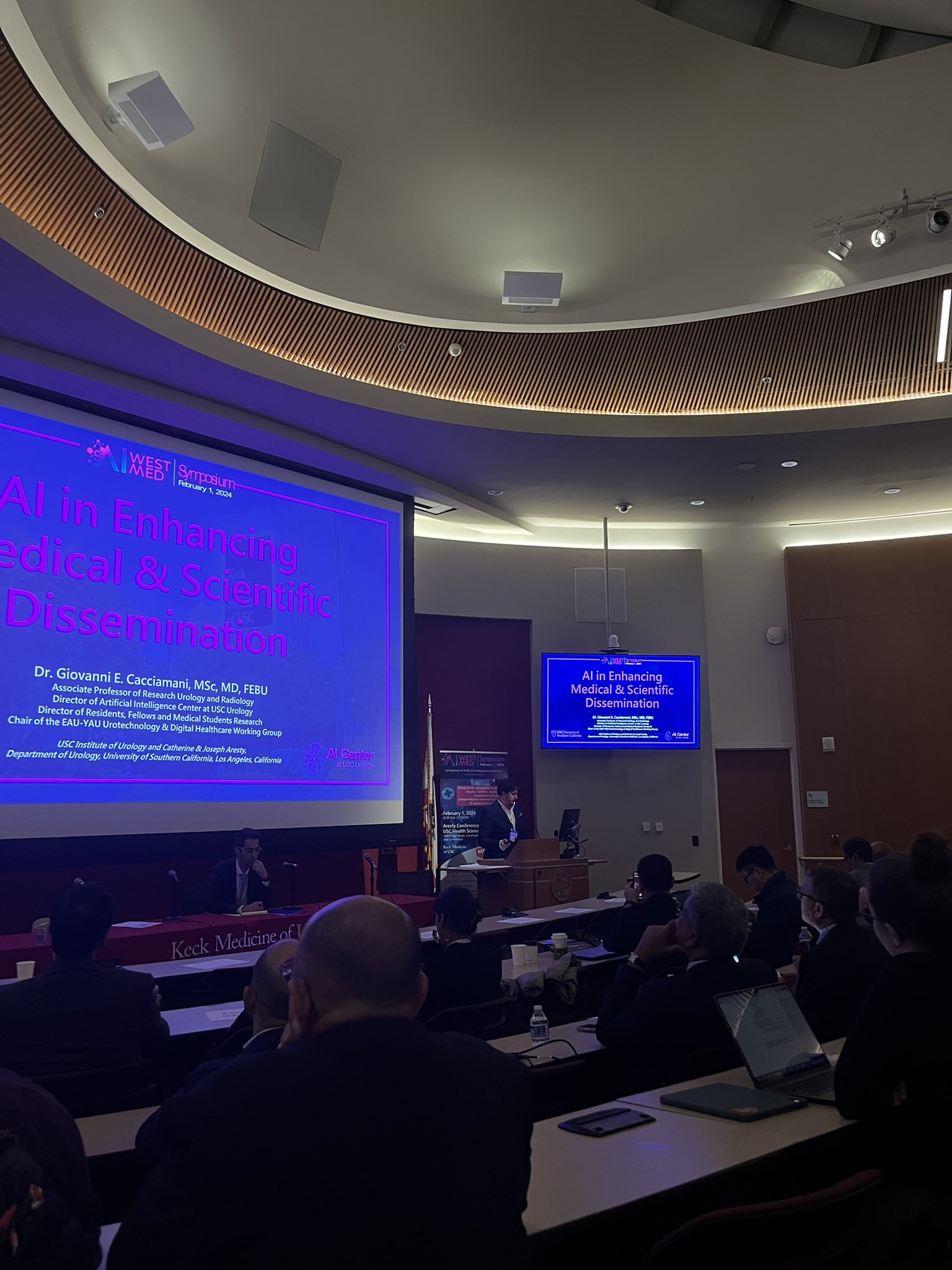 Catherine and Joseph Aresty Auditorium during a healthcare conference on AI innovations.