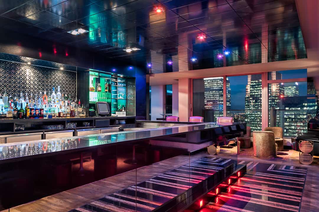 Modern bar with city views at Capeesh Cucina, ideal for networking events and receptions.