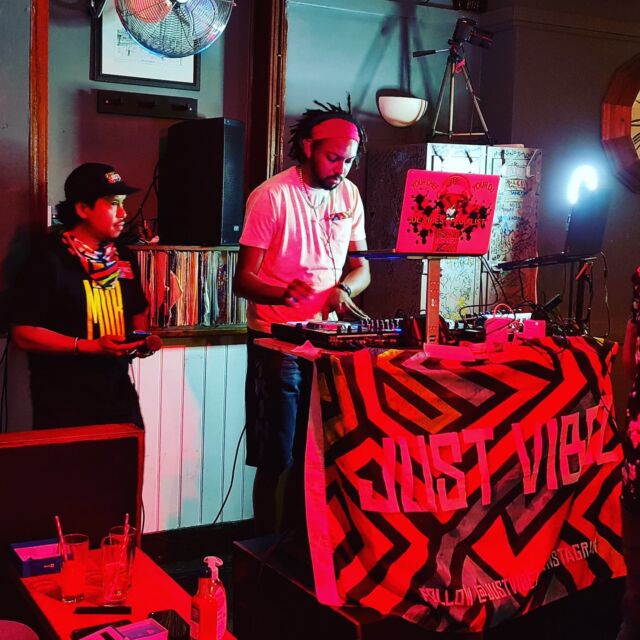 Groupon karaoke room with DJ setup, vibrant decor for lively events and gatherings.