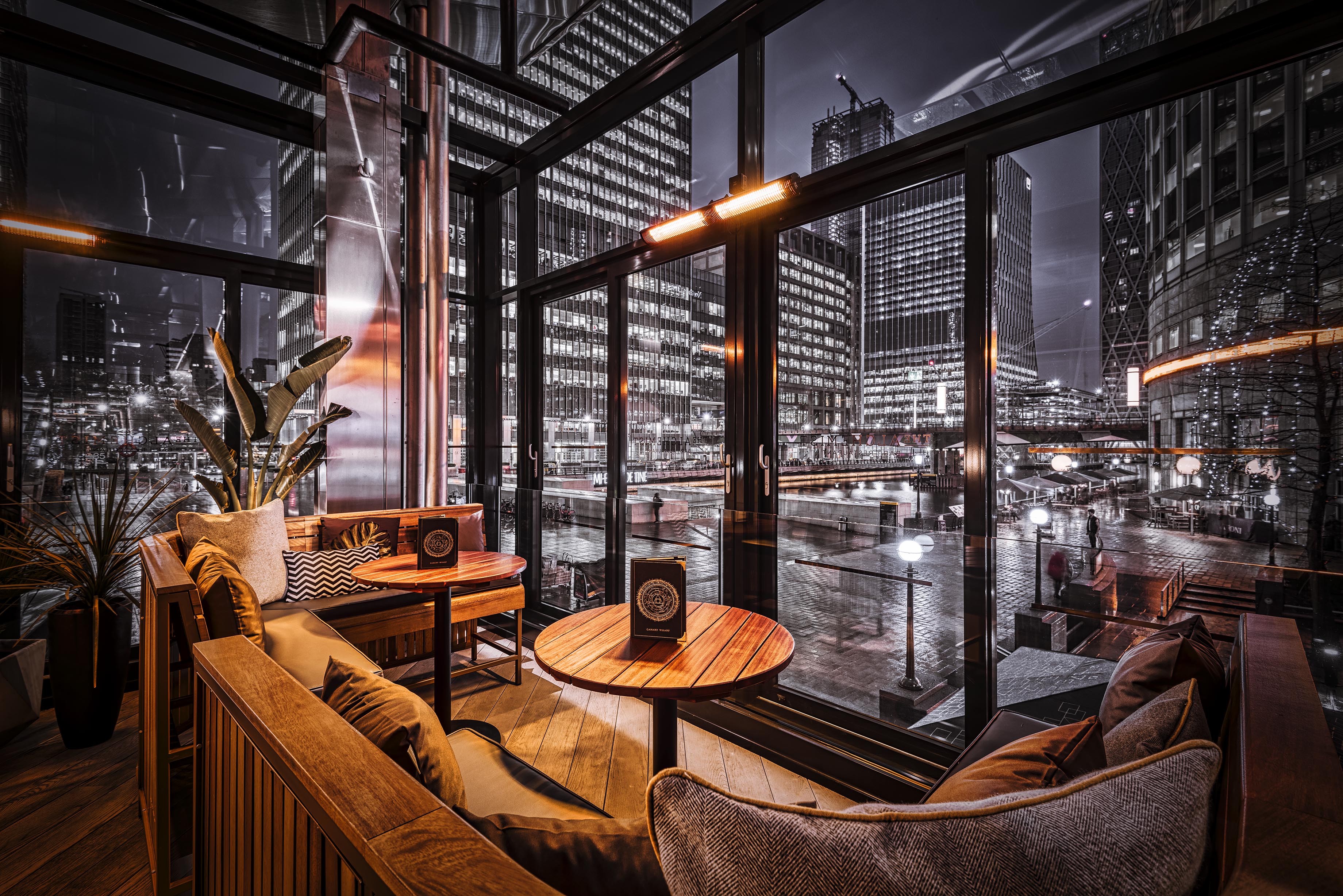Stylish urban lounge with city view, perfect for networking events in Canary Wharf.