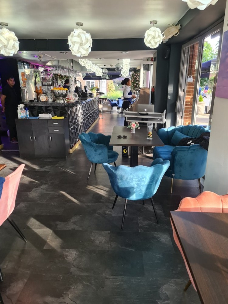 Modern Aqua Vista Bistro Bar with stylish seating for networking events and meetings.