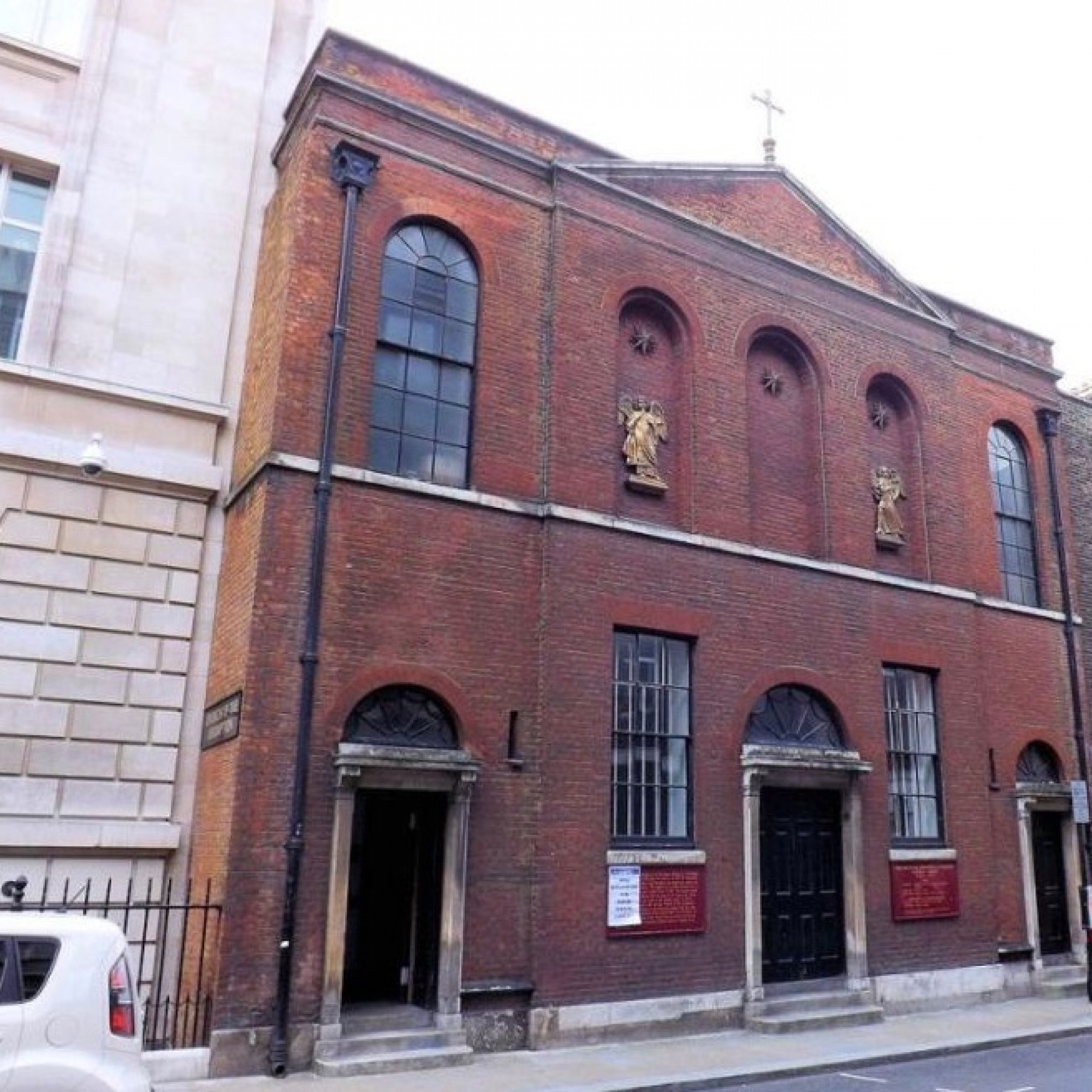 Historic Our Lady of the Assumption Church Hall with brick facade for unique events.