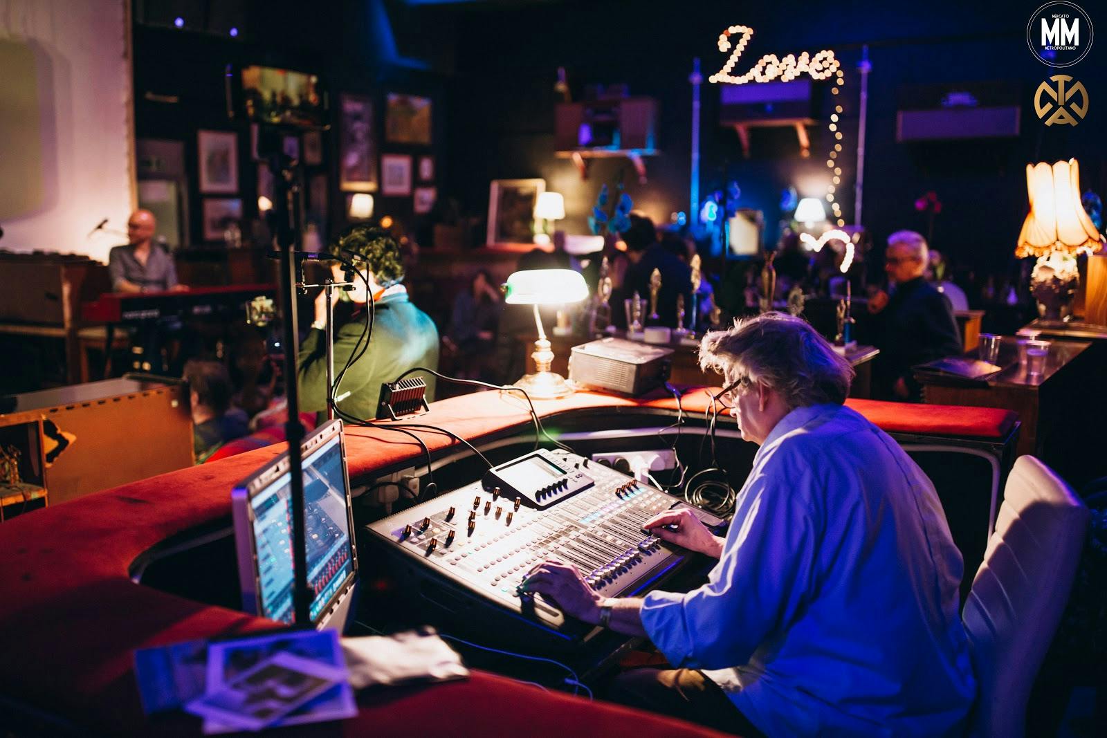 Sound engineer managing audio at TAM's Vineyard for a vibrant live music event.