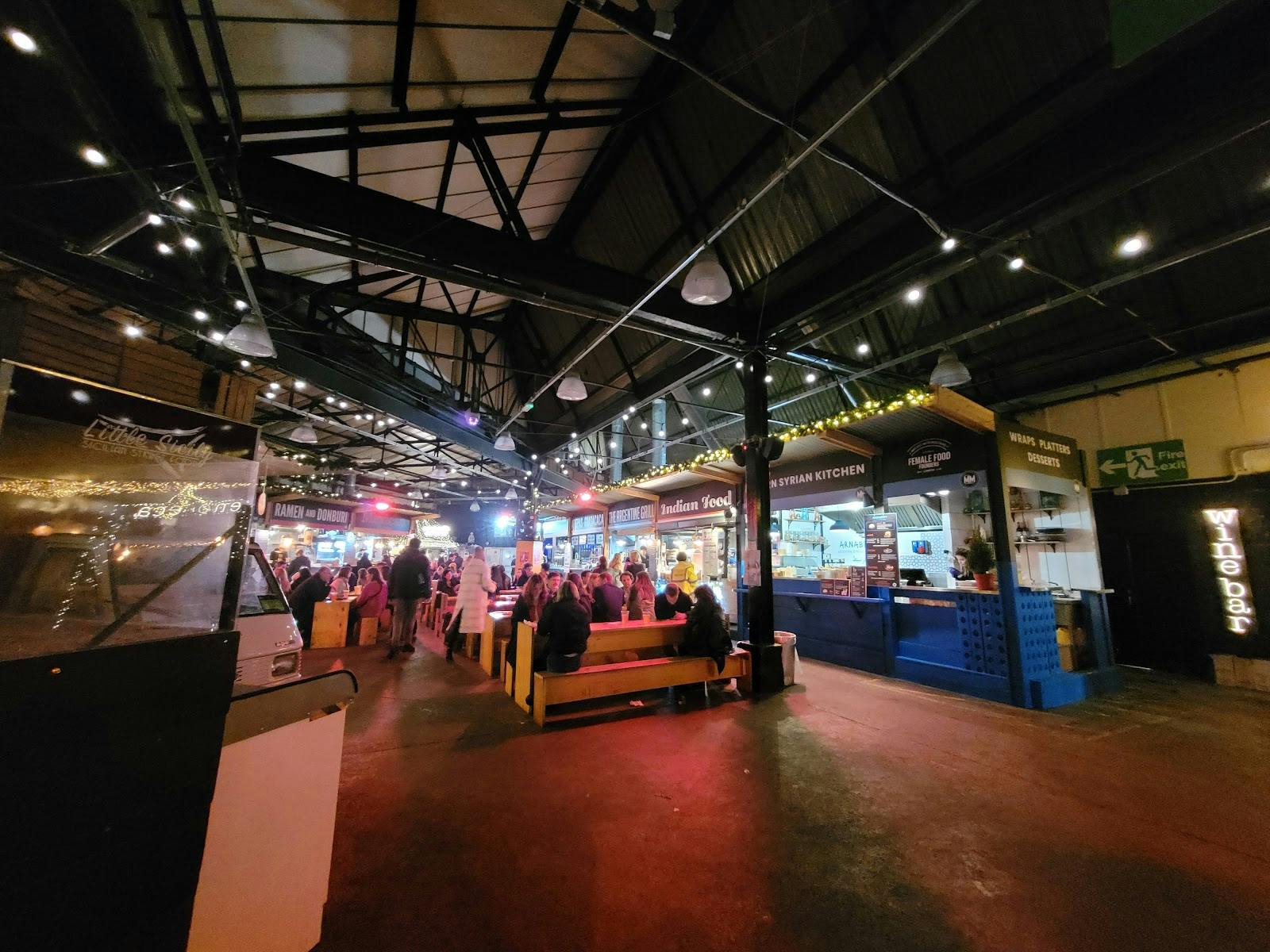 Vibrant TAM's Vineyard event space with colorful seating for networking and gatherings.