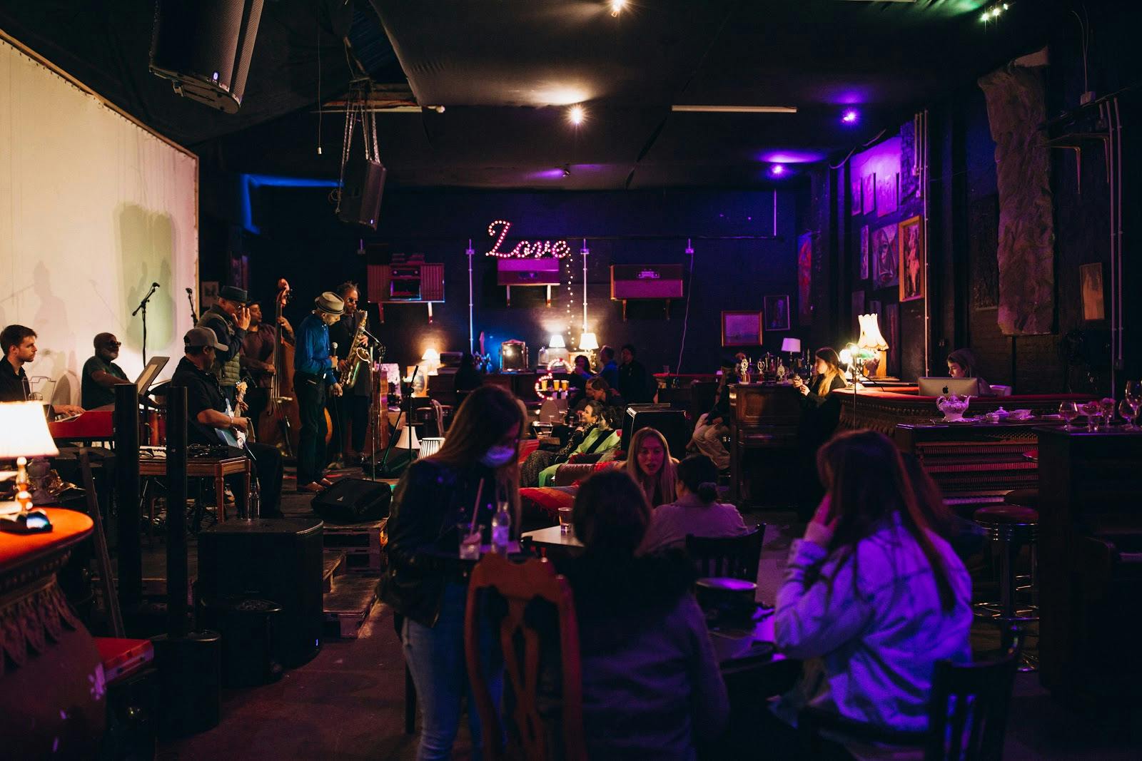 TAM's Vineyard: cozy venue with eclectic decor for live events and networking.