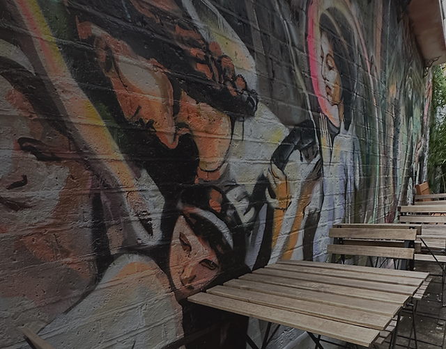 Vibrant mural at The Angel of Bow, ideal for outdoor events and gatherings.