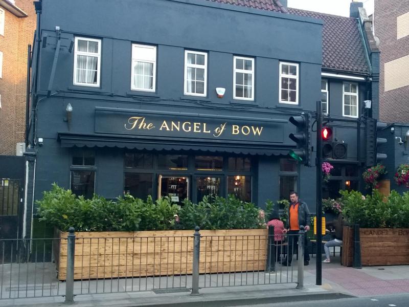 Charming pub "The Angel of Bow" with outdoor seating for casual networking events.