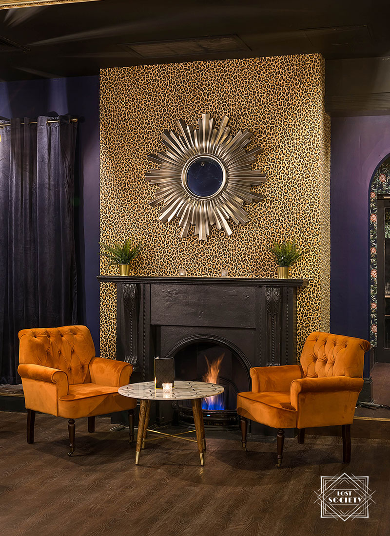 Stylish lounge bar with orange armchairs, perfect for networking events and meetings.