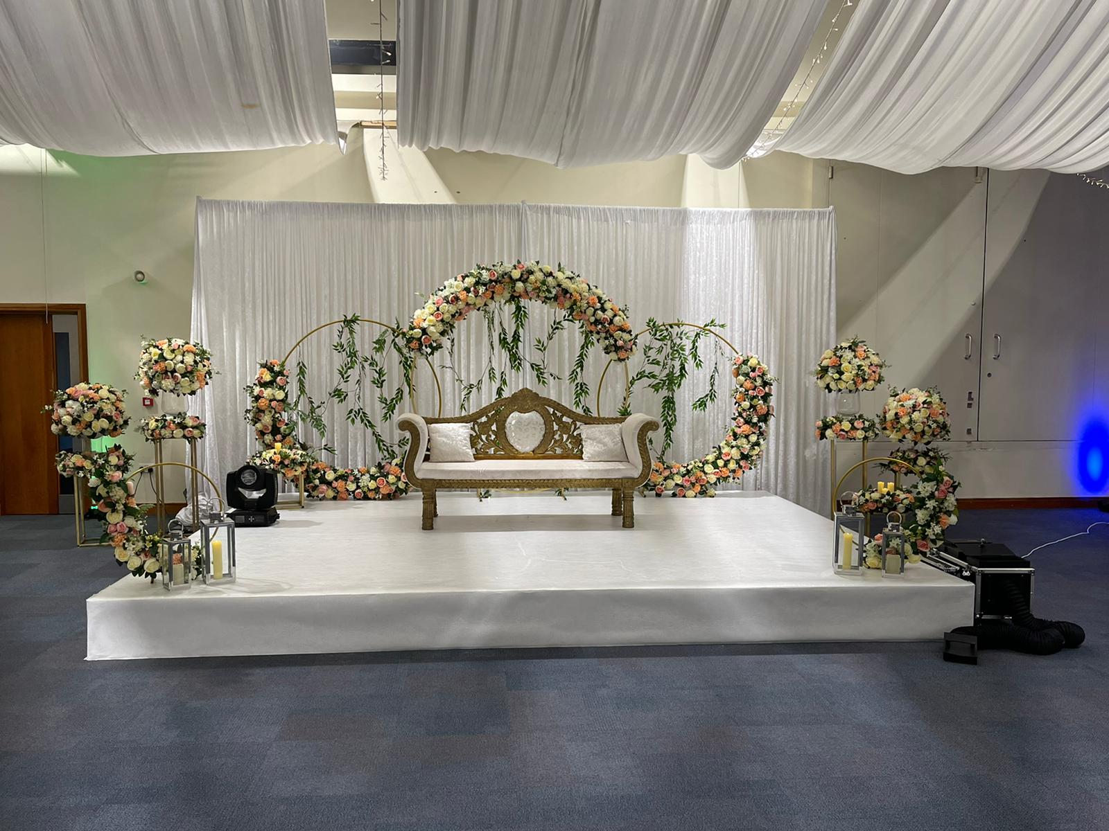 Elegant wedding mandap with floral decor and ambient lighting for upscale events.