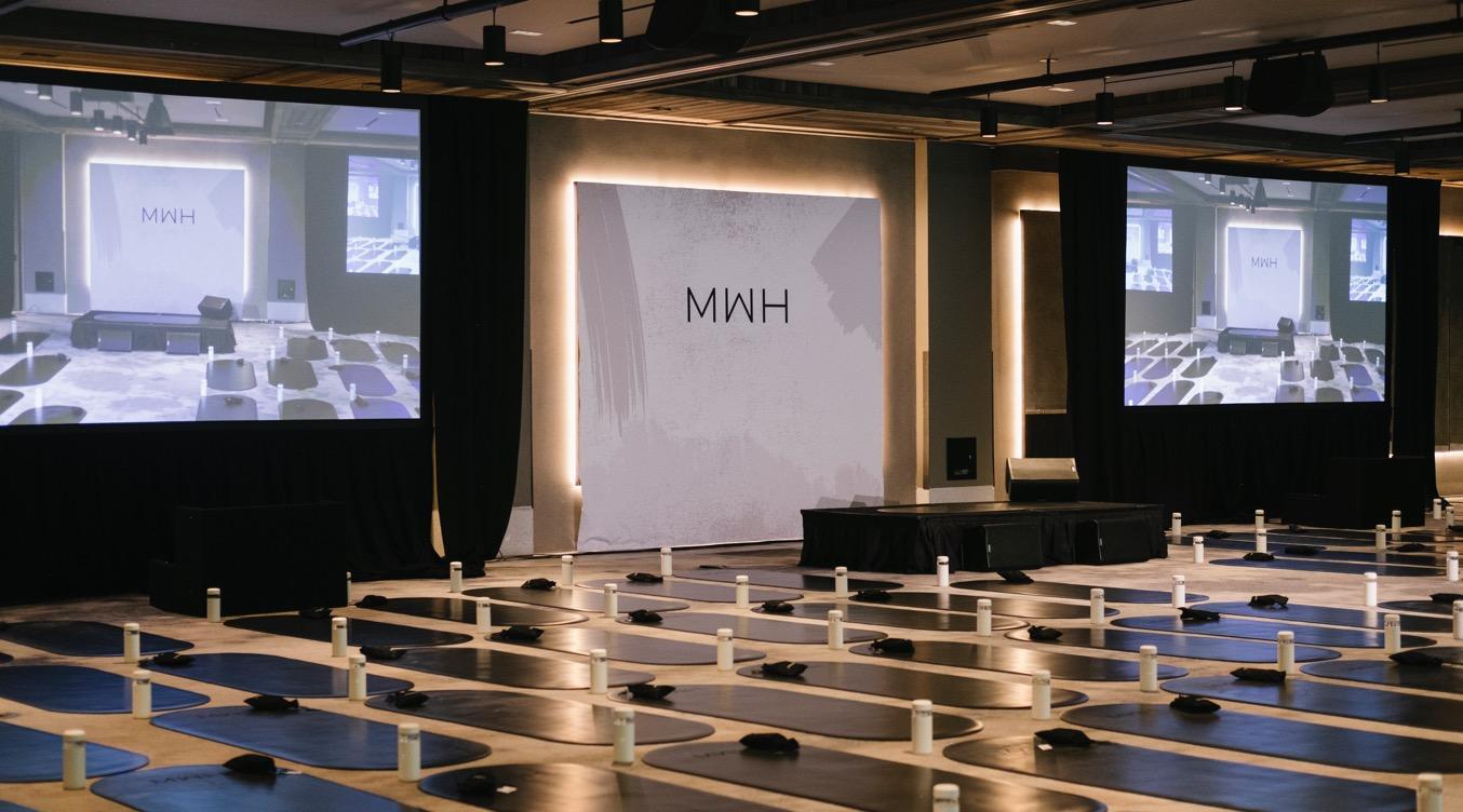 Wellness event space with yoga mats, ideal for corporate retreats and mindfulness sessions.
