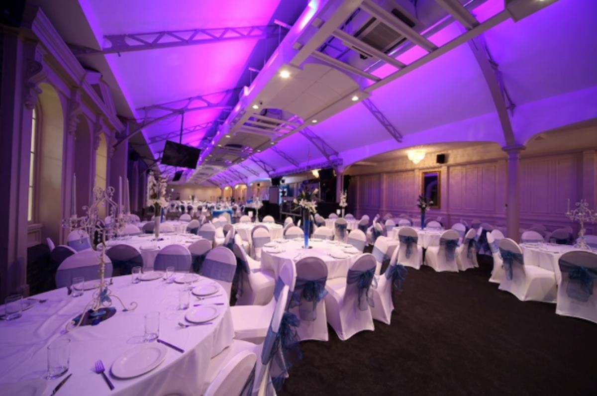 Elegant event space with round tables, ideal for corporate gatherings and upscale celebrations.