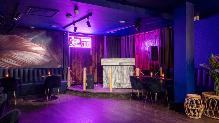 Stylish Cottons Club event space with marble bar, ideal for live performances and gatherings.