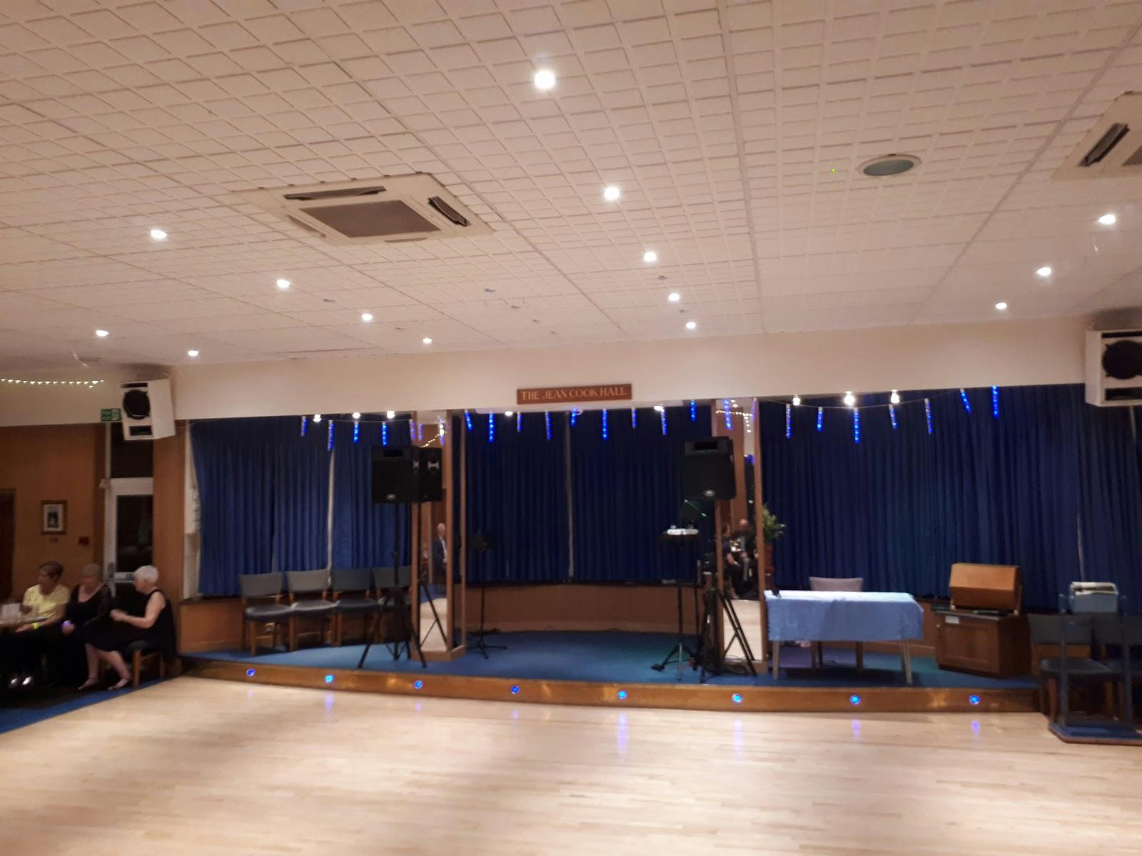 Versatile event space with polished wooden floor at North Enfield Conservative Club.