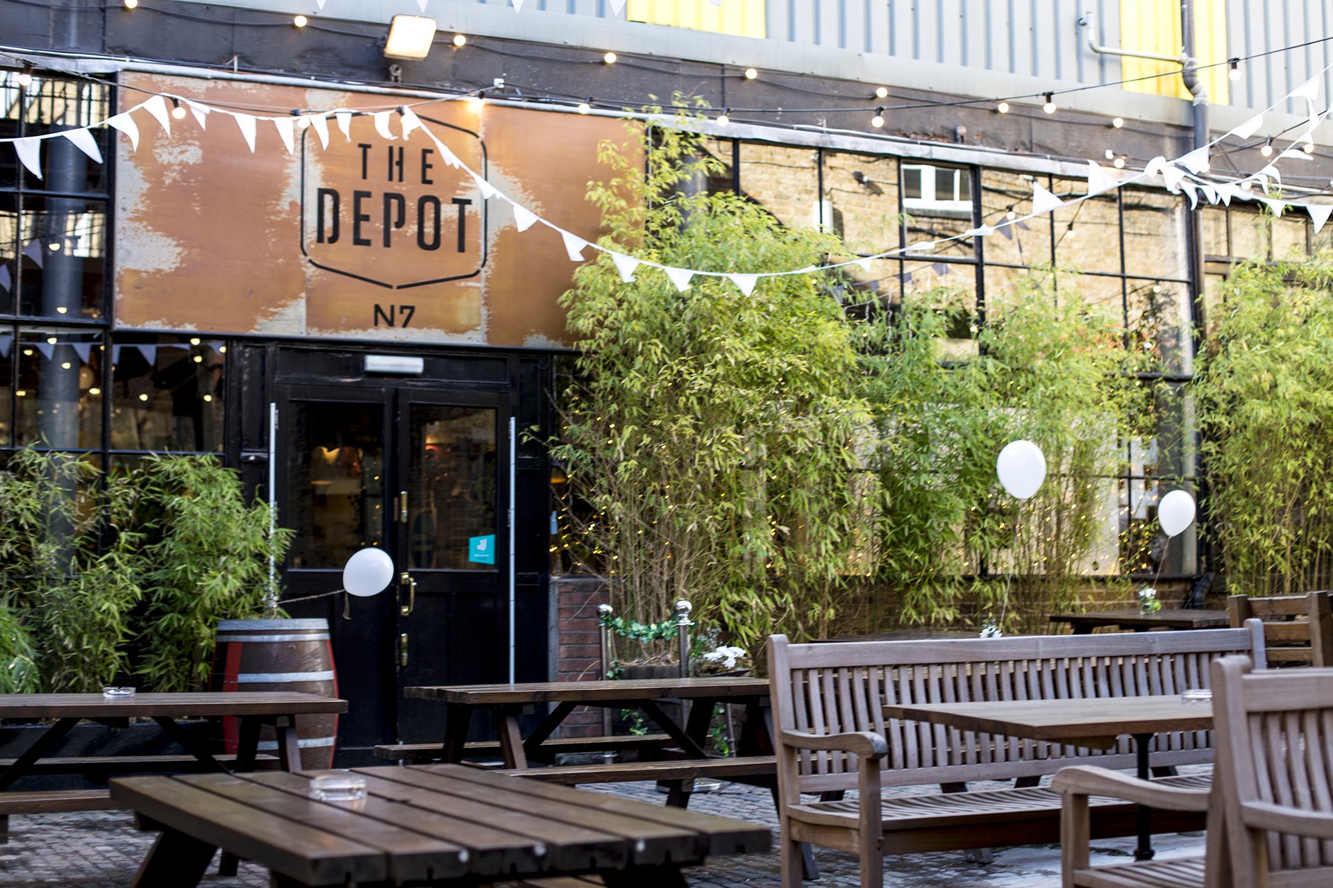 Charming outdoor venue with rustic facade, ideal for casual gatherings and events.