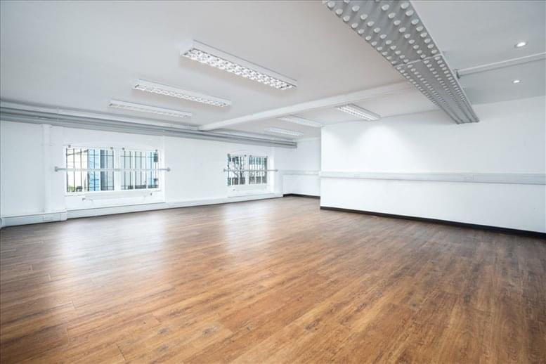 Versatile event space with wooden flooring, ideal for workshops and meetings in Busworks.