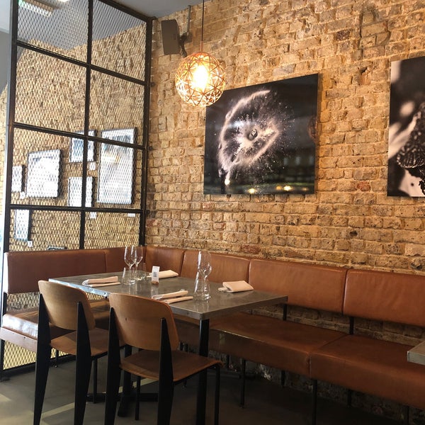 Stylish Margaux bar with exposed brick, perfect for private dinners and networking events.