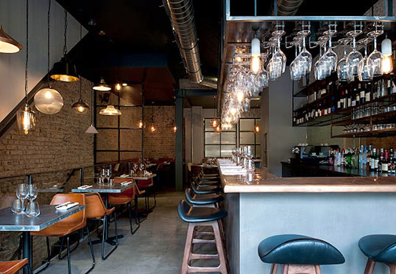 Stylish Margaux bar interior with warm lighting, perfect for intimate events and gatherings.