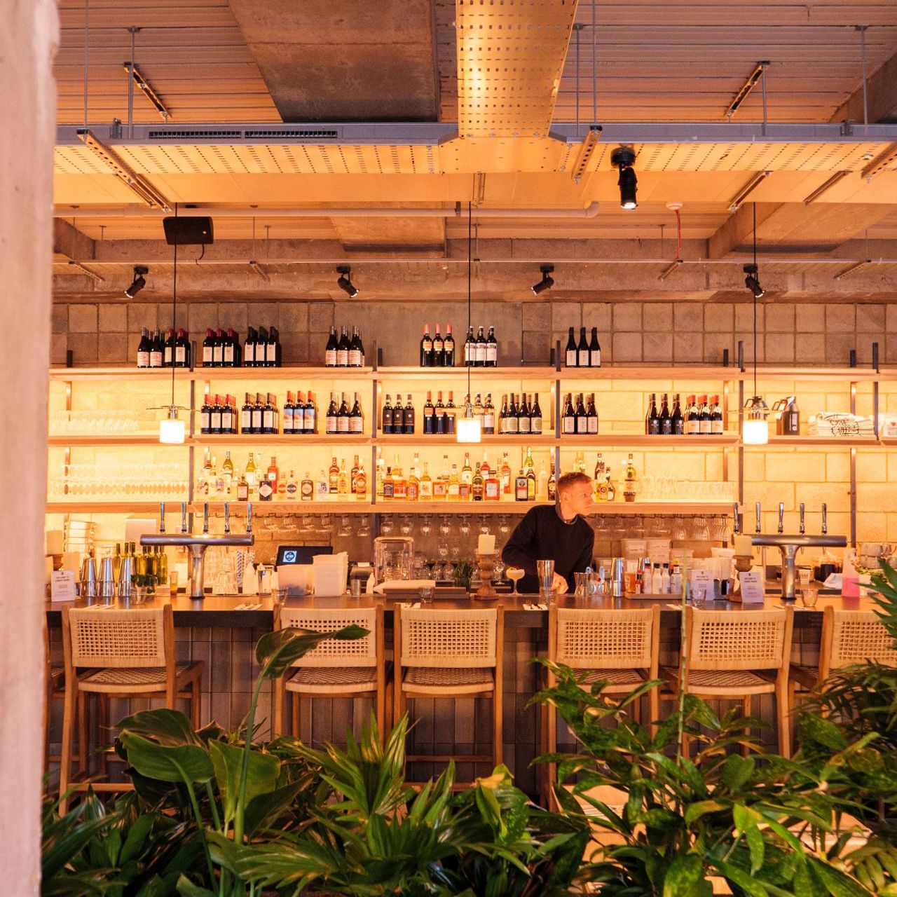 Stylish bar at Caravan Canary Wharf, perfect for networking events and social gatherings.