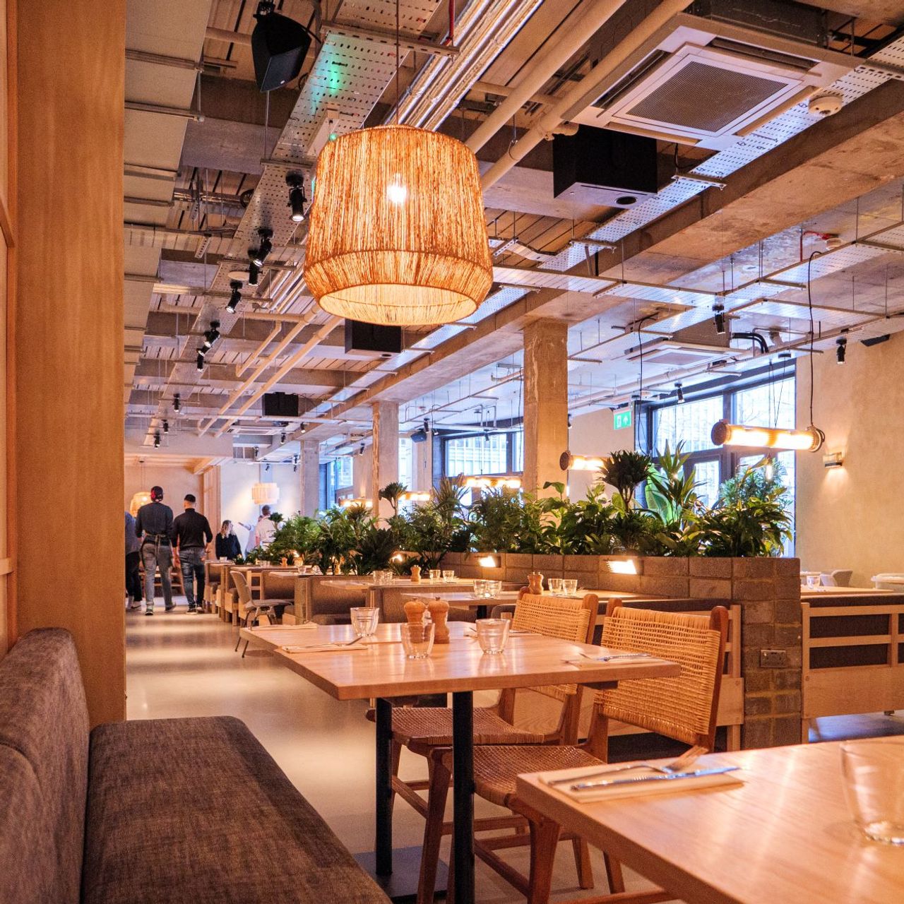 Modern Main Restaurant at Caravan Canary Wharf, ideal for networking events and meetings.