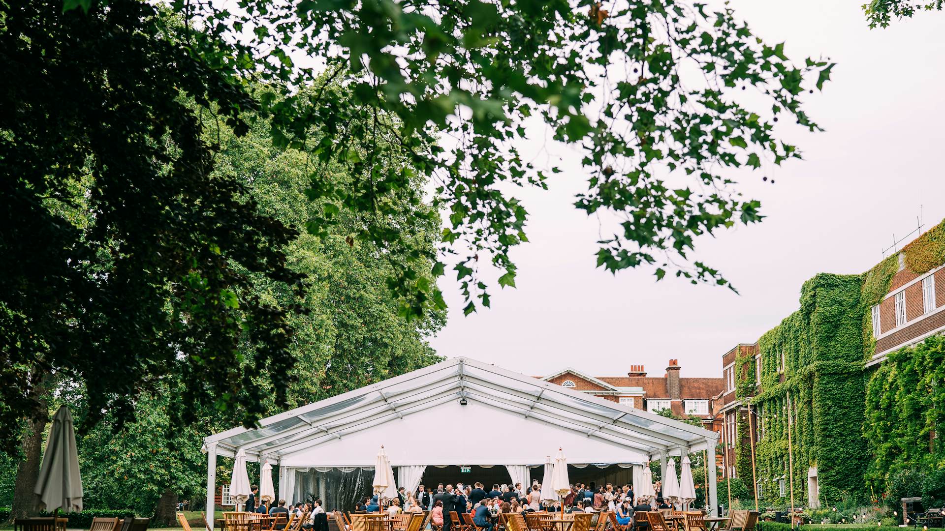 Outdoor event at York Lawns, featuring a spacious marquee and lush greenery for networking.