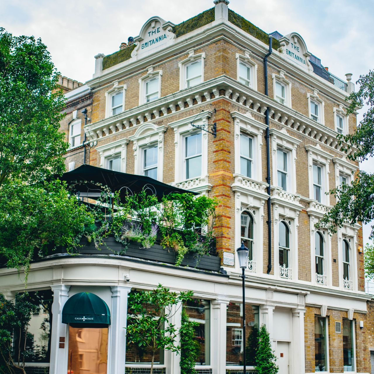 Roof Terrace at Casa Cruz London with lush greenery, perfect for events and gatherings.