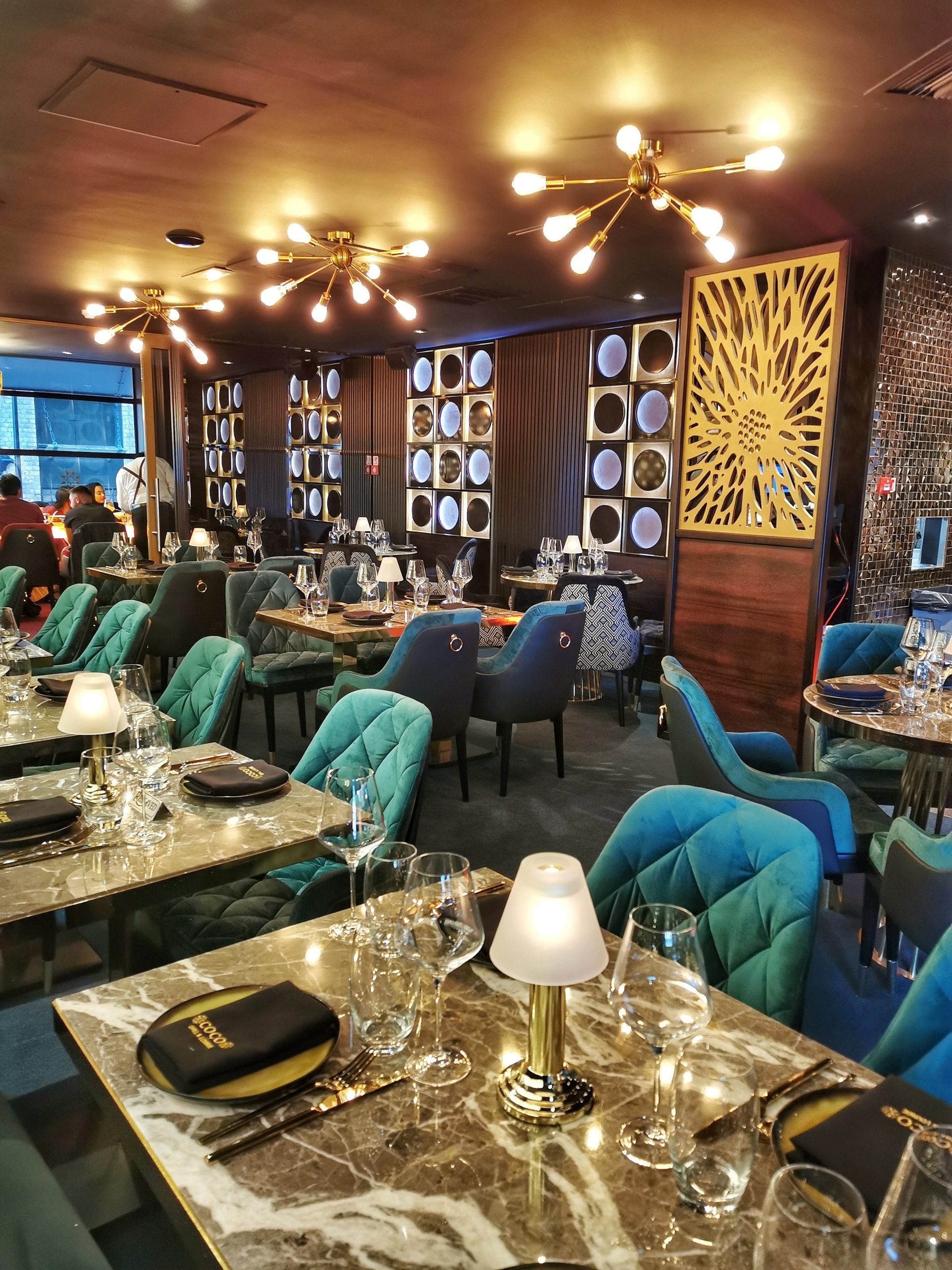 Elegant COCO Restaurants bar with plush seating for upscale events and gatherings.