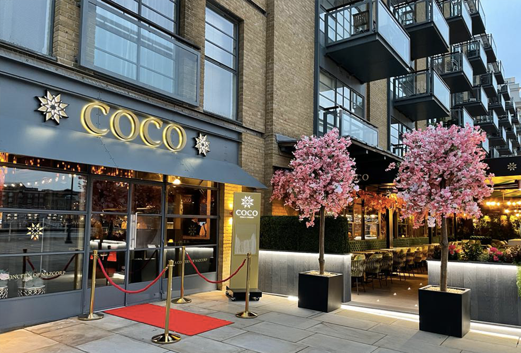 Elegant restaurant entrance with cherry blossoms, perfect for upscale events and gatherings.