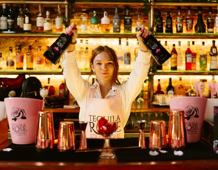 Vibrant bar scene with enthusiastic bartender for social events and celebrations.