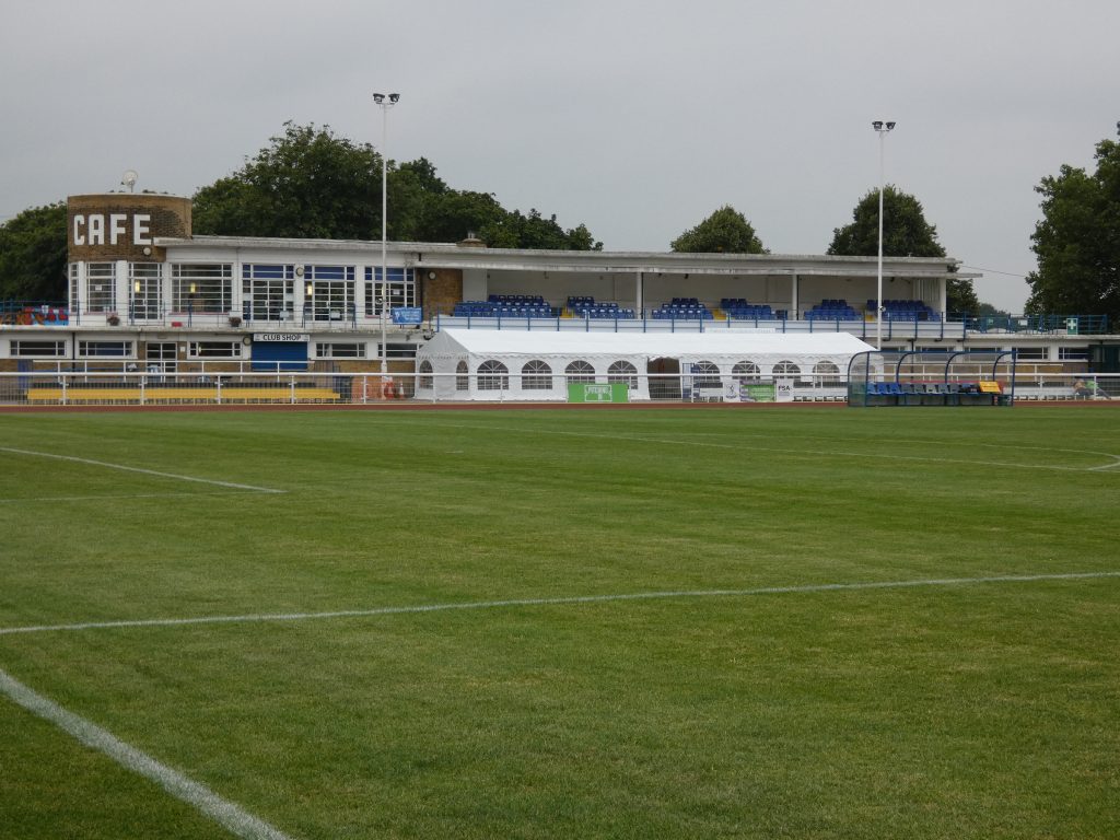 Queen Elizabeth II Stadium with green field, ideal for events and gatherings in Enfield.