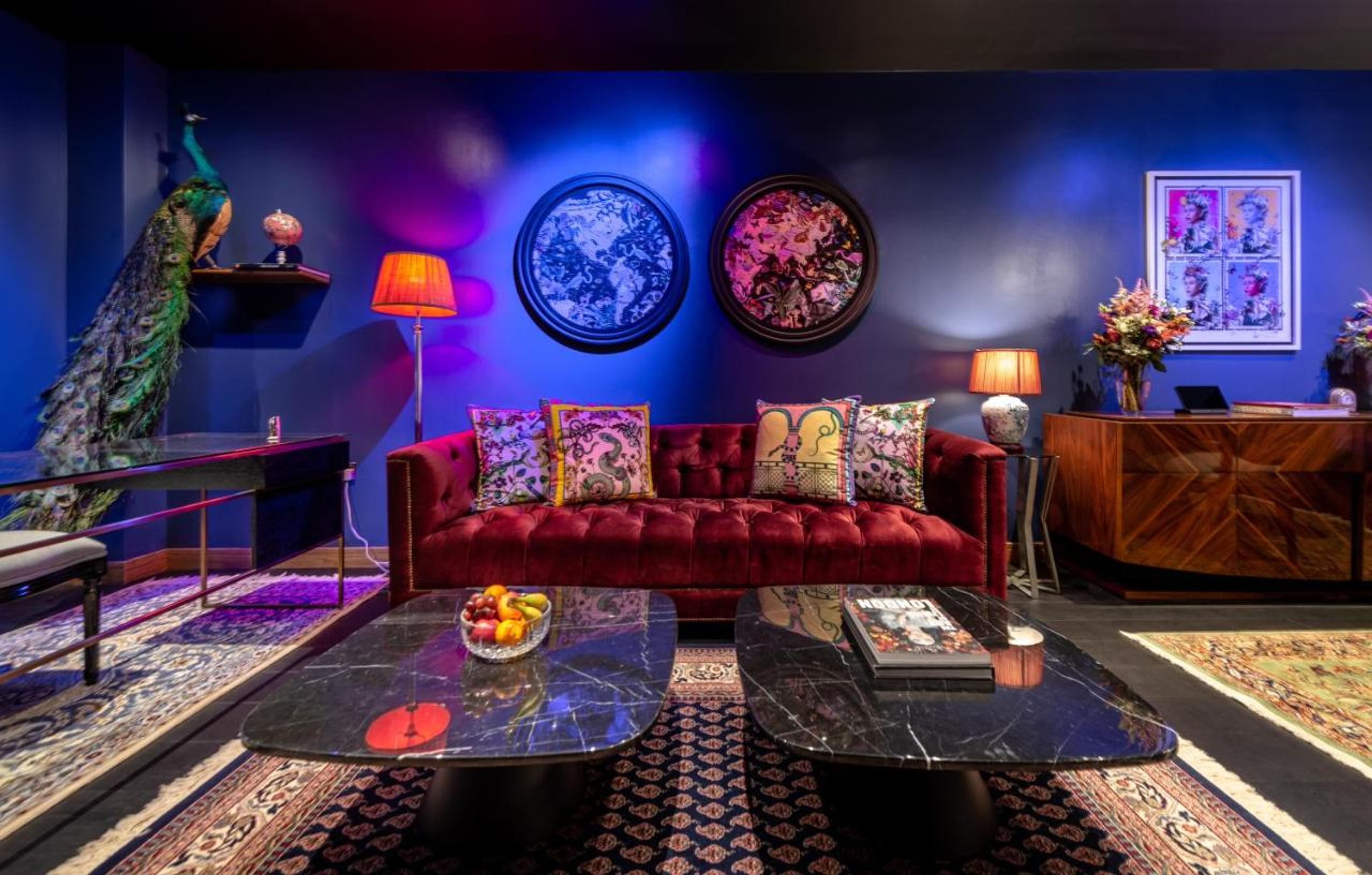 Stylish lounge at Hux Hotel with peacock decor for networking events and relaxation.