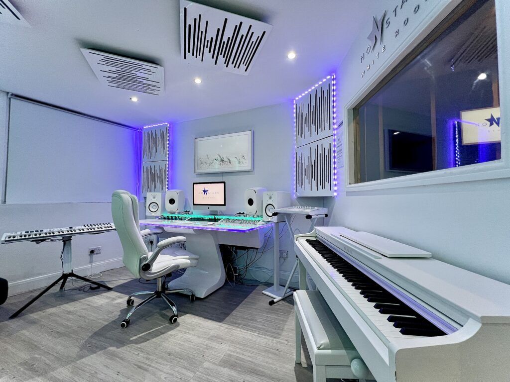 Modern recording studio with high-quality sound equipment for music production workshops.