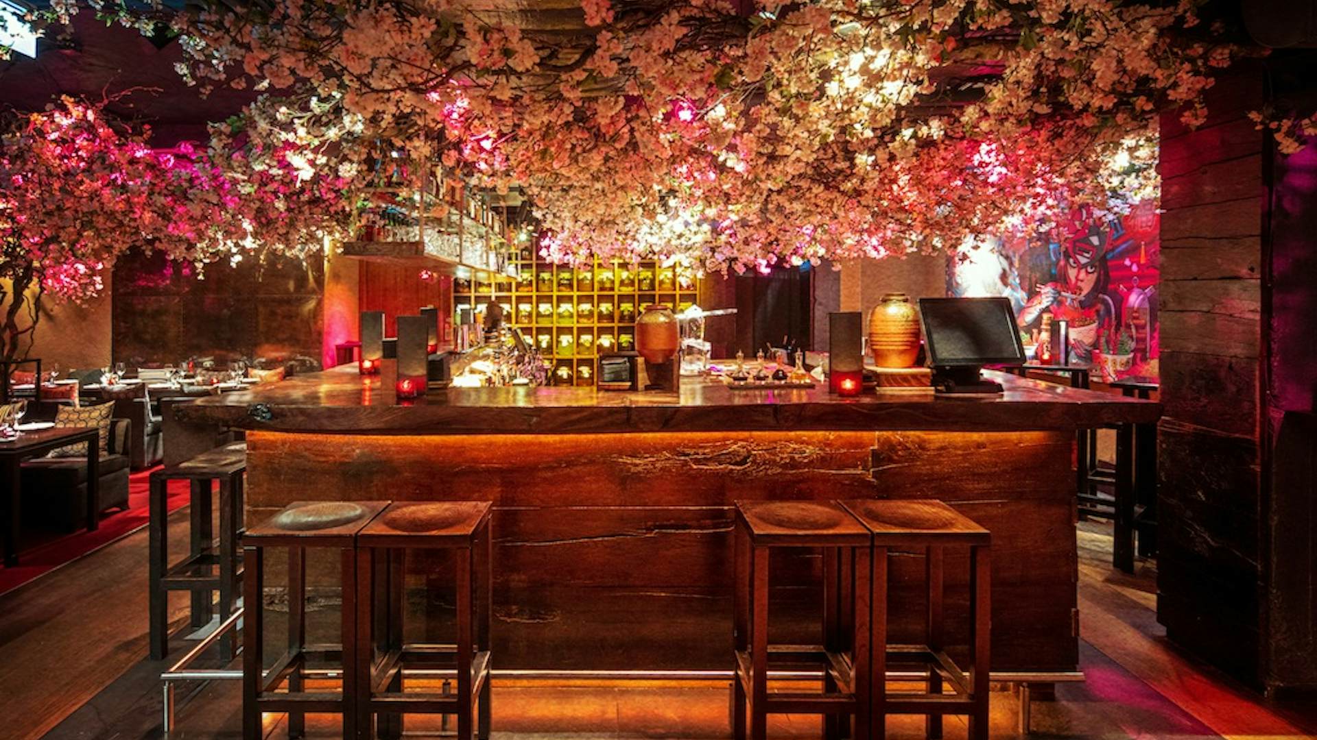 Stylish Roka Club bar with cherry blossom decor, perfect for upscale events and gatherings.