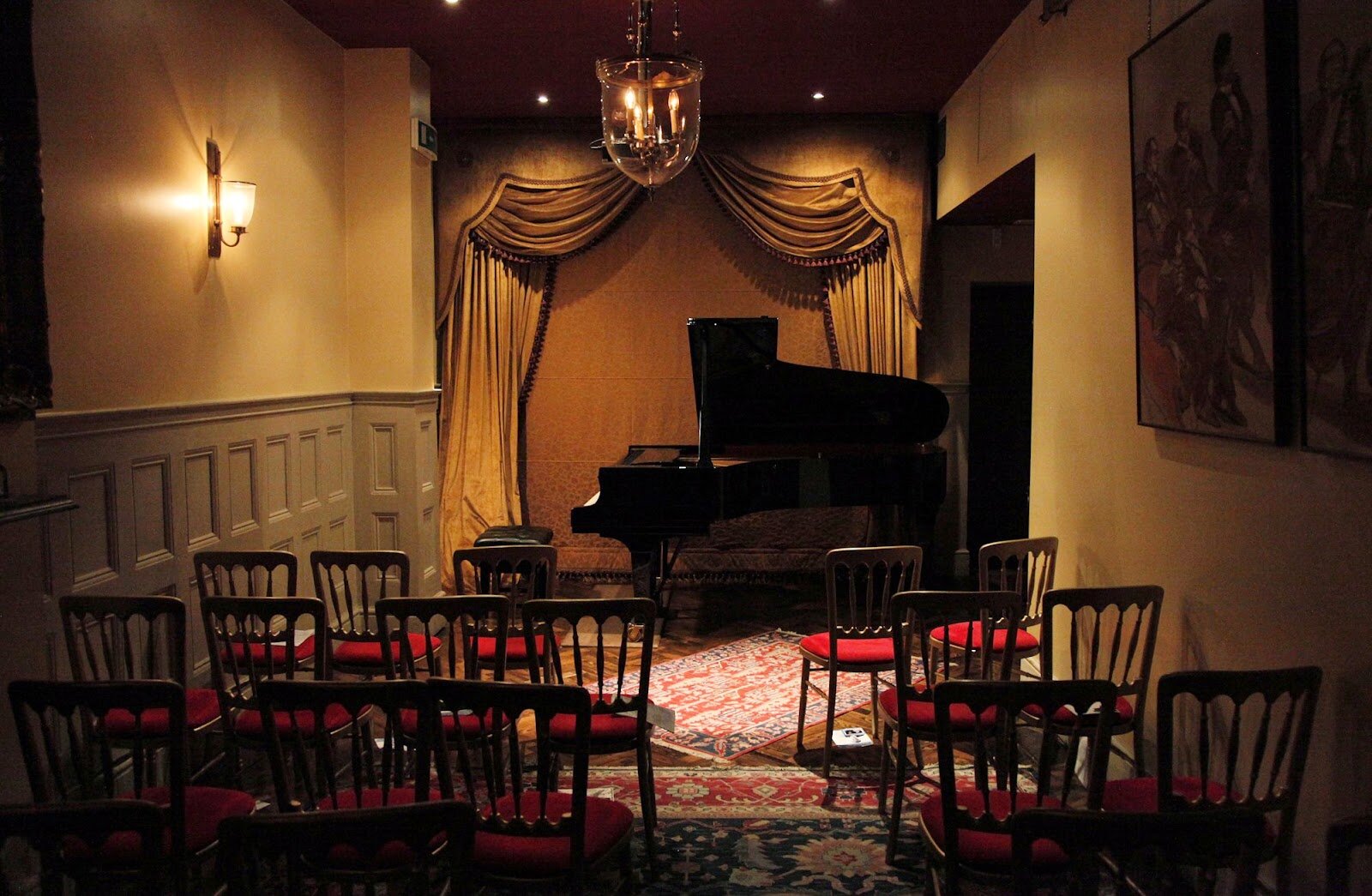 Intimate event space with grand piano, ideal for music events and private gatherings.