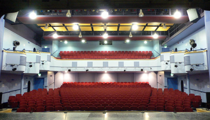 Lighthouse Theatre auditorium with tiered seating, ideal for conferences and presentations.
