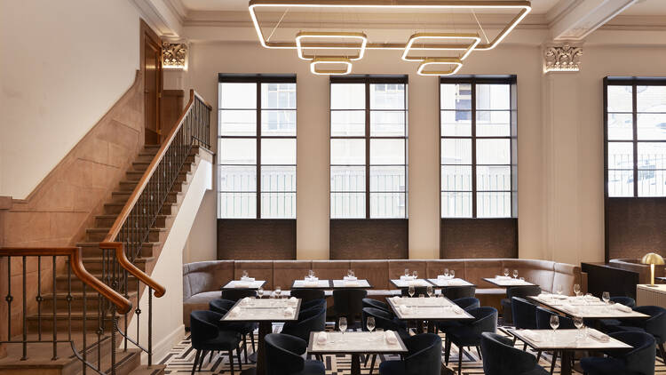 Sophisticated dining room with modern lighting for corporate meetings and upscale events.