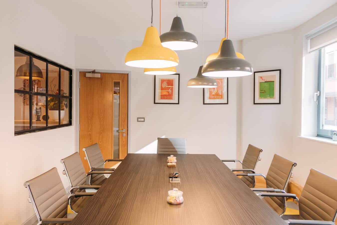 Modern conference room with ergonomic chairs for productive meetings at Wizu Workspace.