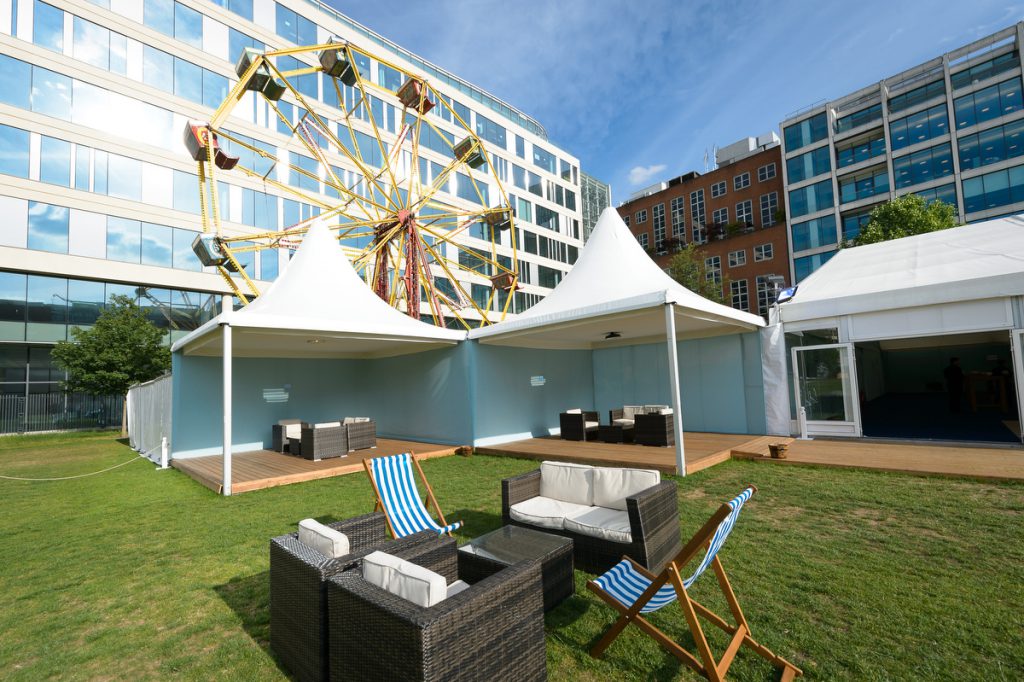Funfair at City Central with stylish tents, Ferris wheel, ideal for networking events.