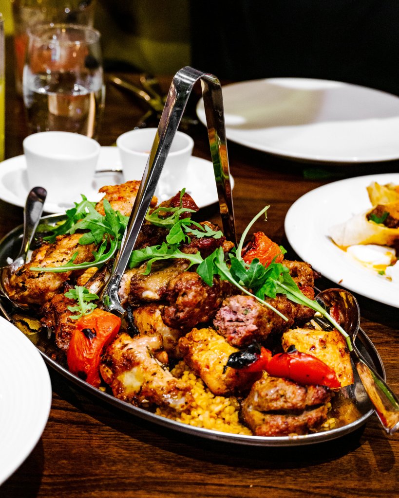 Roasted chicken platter at Kibele Restaurant, perfect for events and catering.