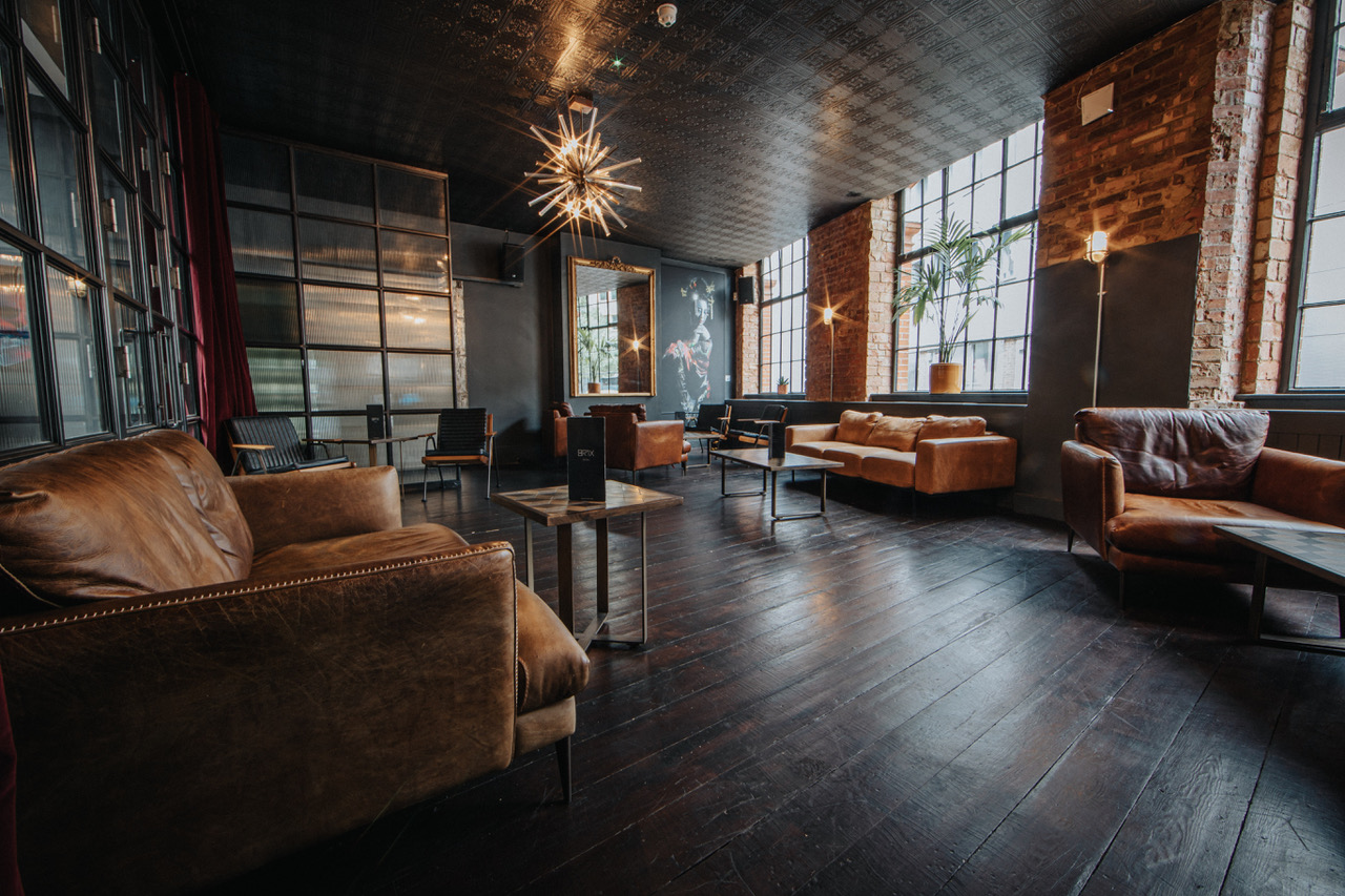 Stylish lounge bar in Brix Ldn with warm lighting, ideal for networking events.