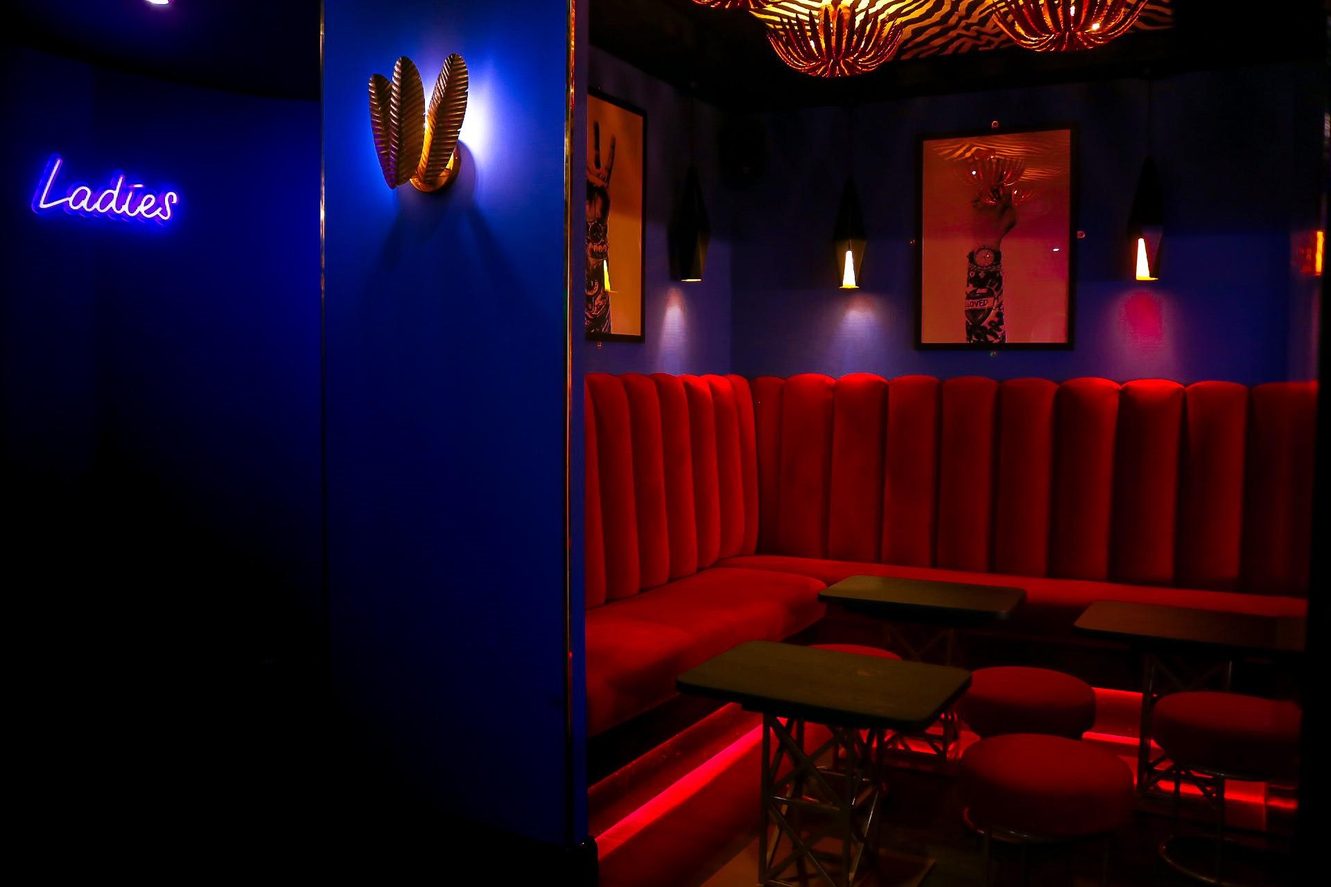 Dance floor at DOLCE Night Club with plush seating, ideal for networking events.