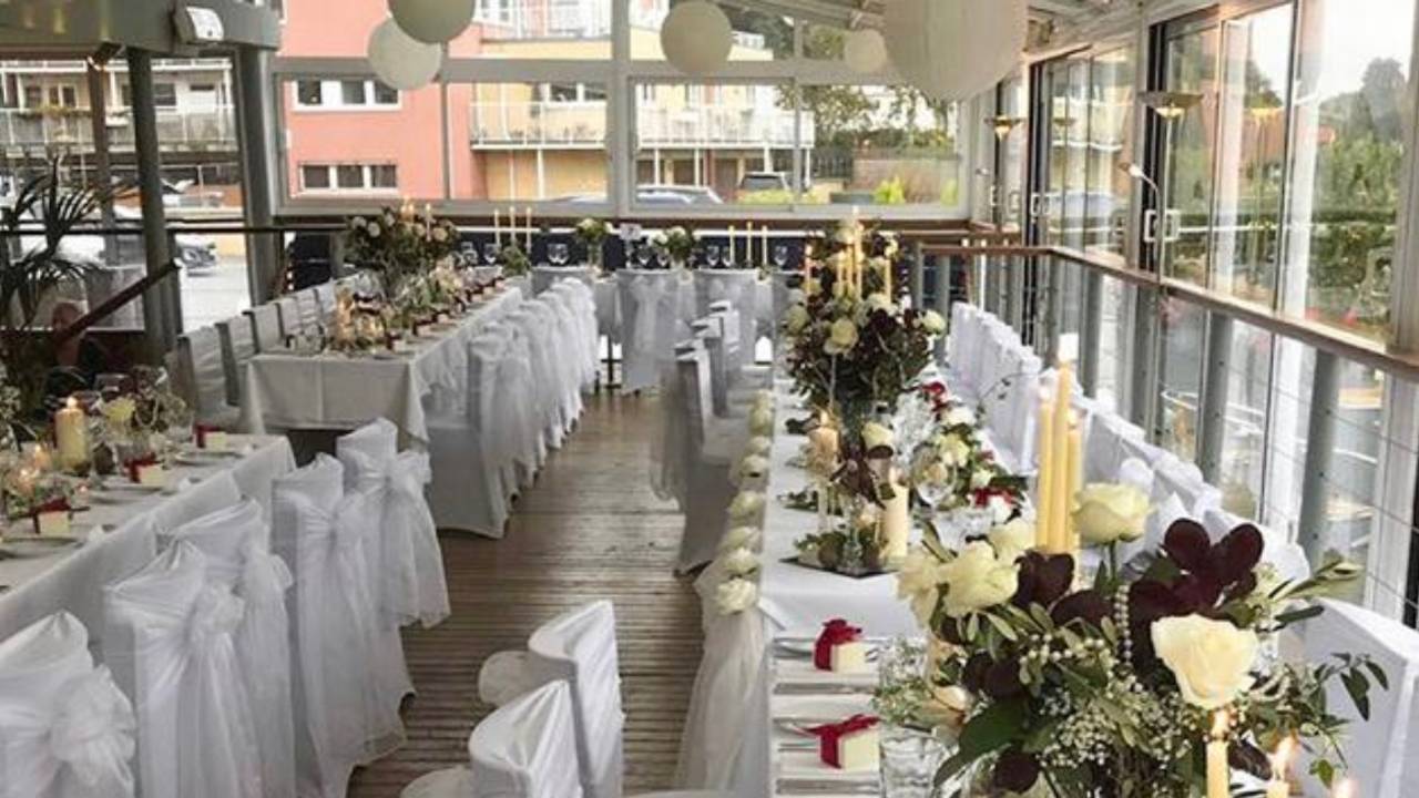Glass-walled dining room at The Wharf Teddington, ideal for weddings and formal events.