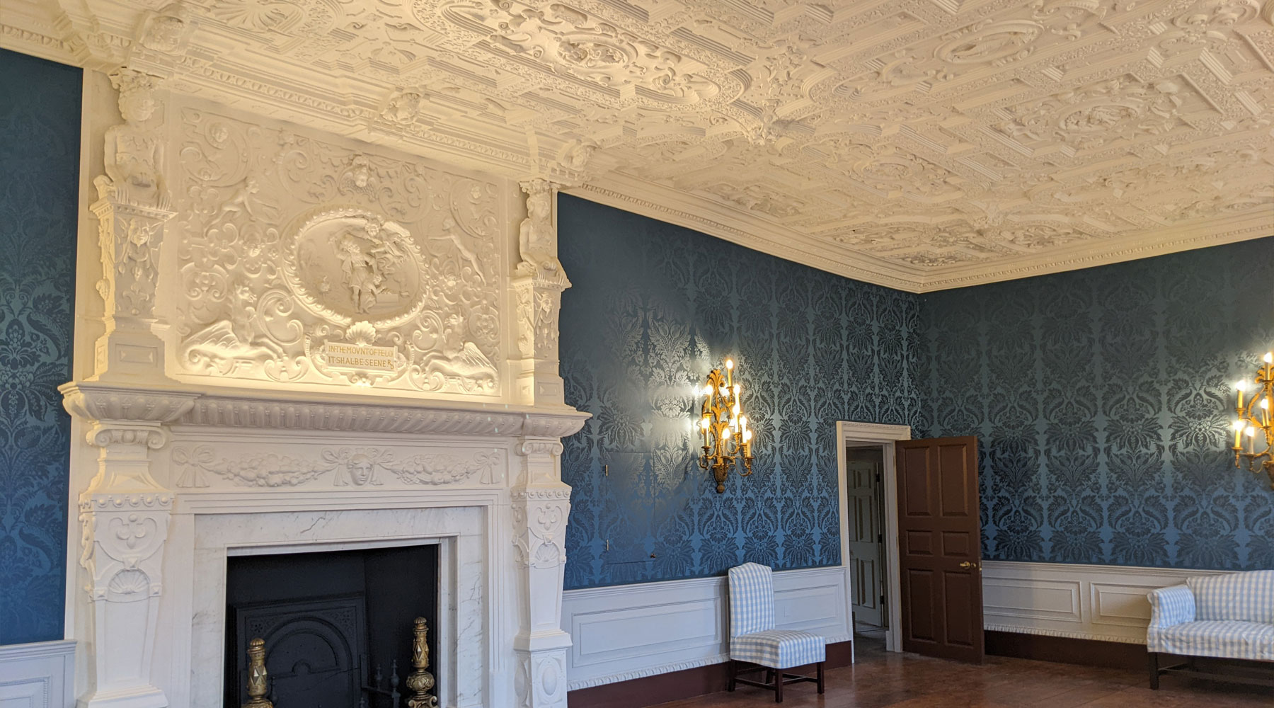 Elegant Boston Manor House meeting space with ornate plasterwork and blue wallpaper.