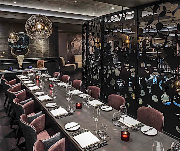 Private dining space with elegant table setting for intimate gatherings and corporate events.