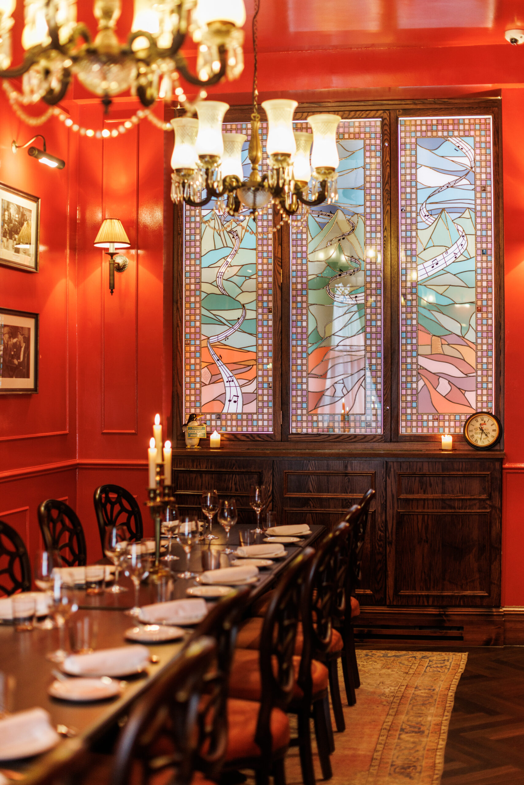 Elegant dining room with stained glass windows for intimate gatherings and upscale events.