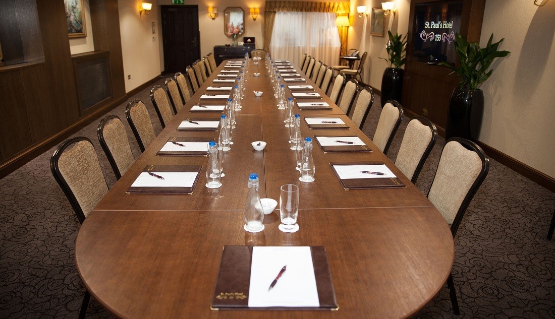 Conference Room at St Pauls Hotel with oval table, ideal for professional meetings.