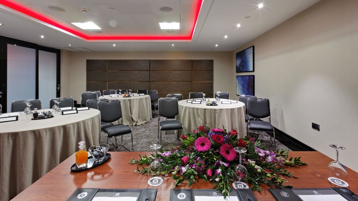 Conference Room at St Pauls Hotel with elegant round tables for corporate events.